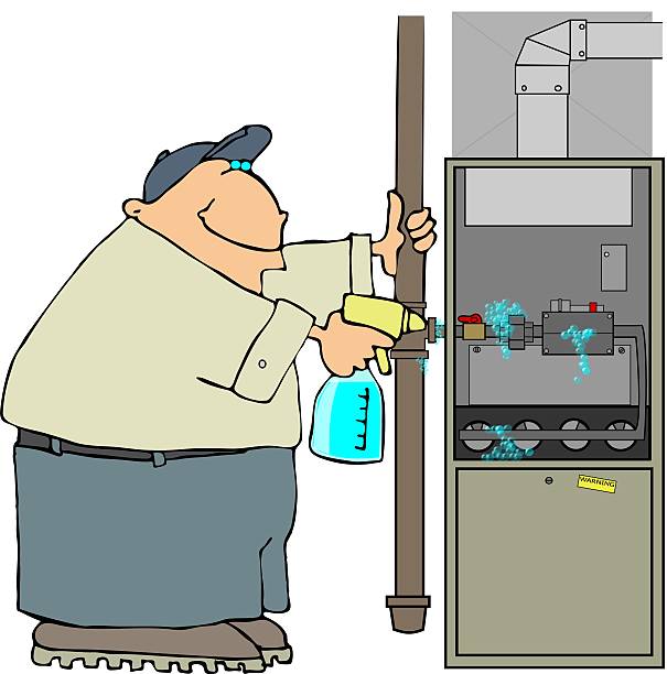 man inspecting furnace